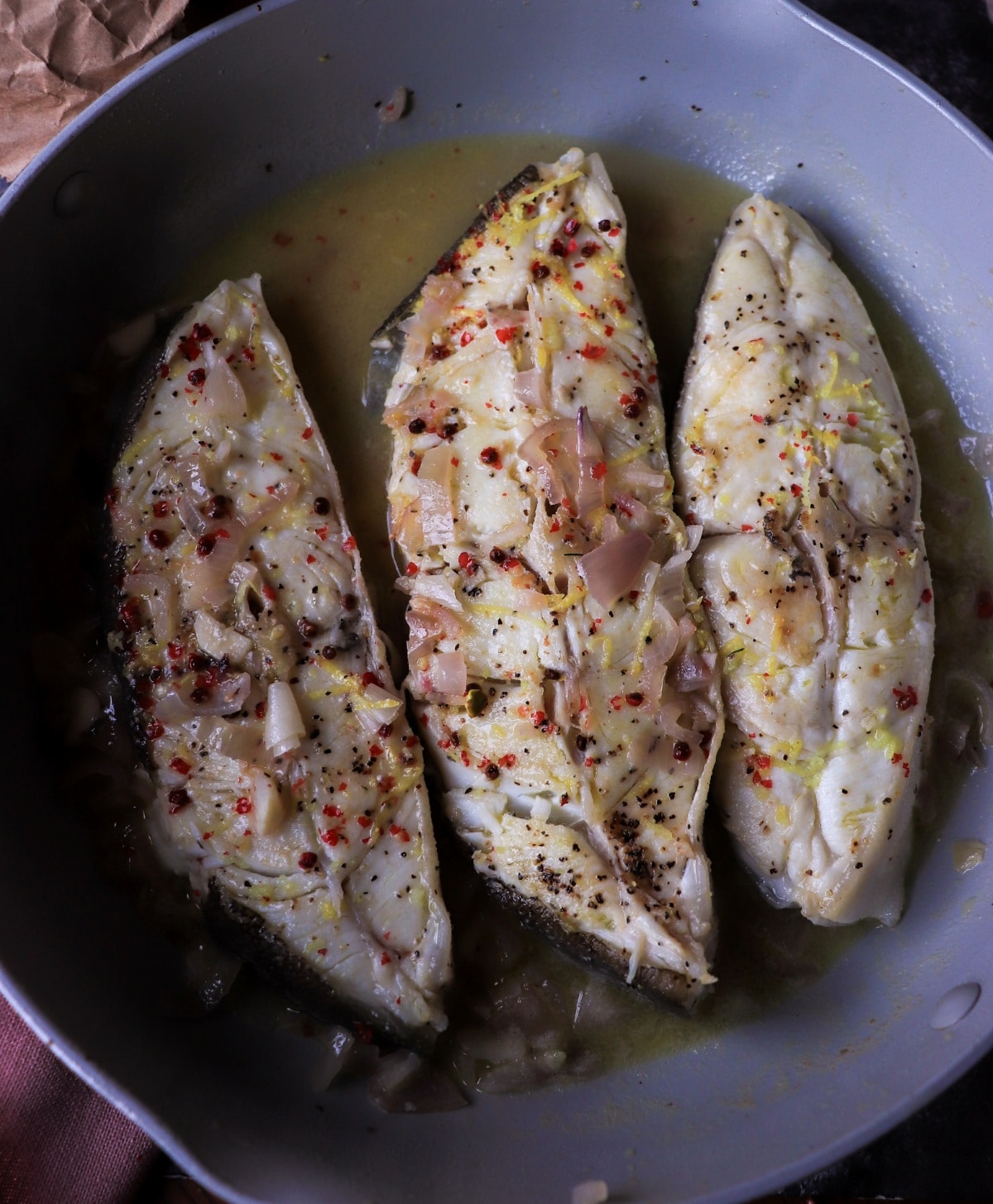 One-pan halibut in white wine and shallot broth.