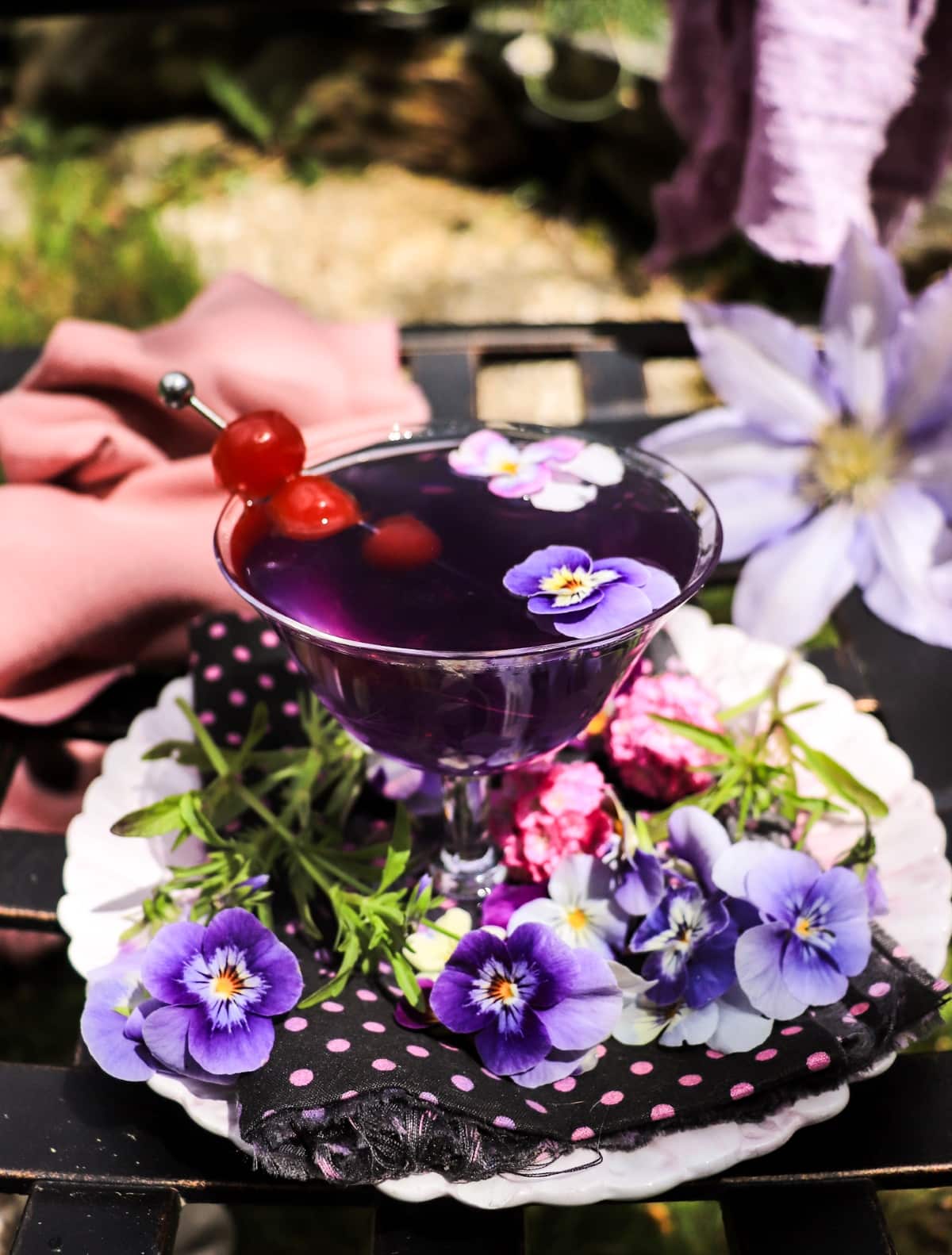 Elegant Aviation cocktail with violet liqueur and Luxardo cherries