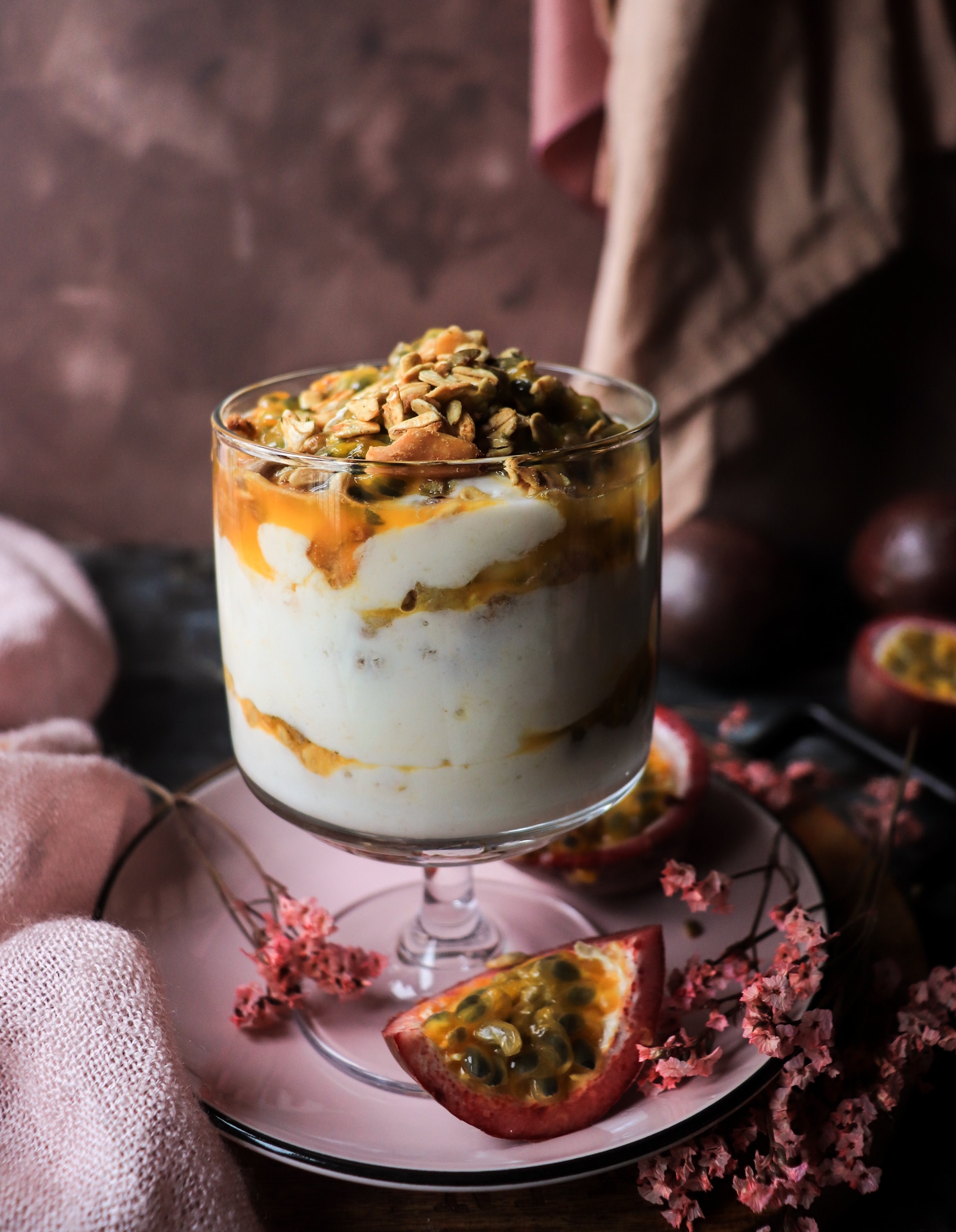 Greek yogurt parfait with banana, passion fruit, and granola