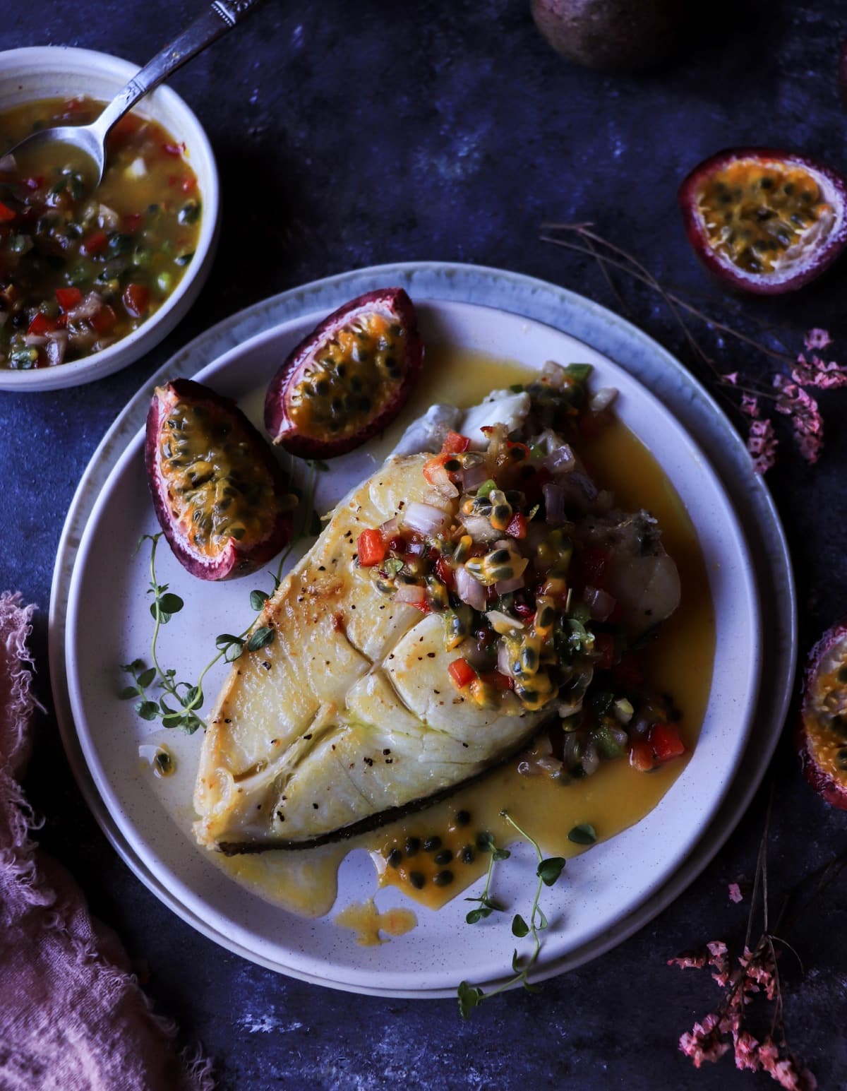 Halibut with passion fruit salsa featuring shallots, jalapeño, and thyme.