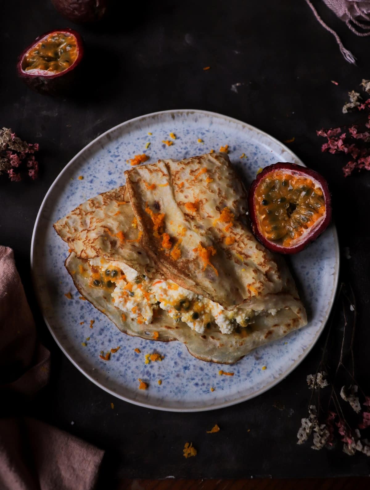 Crepes filled with ricotta and fresh passion fruit