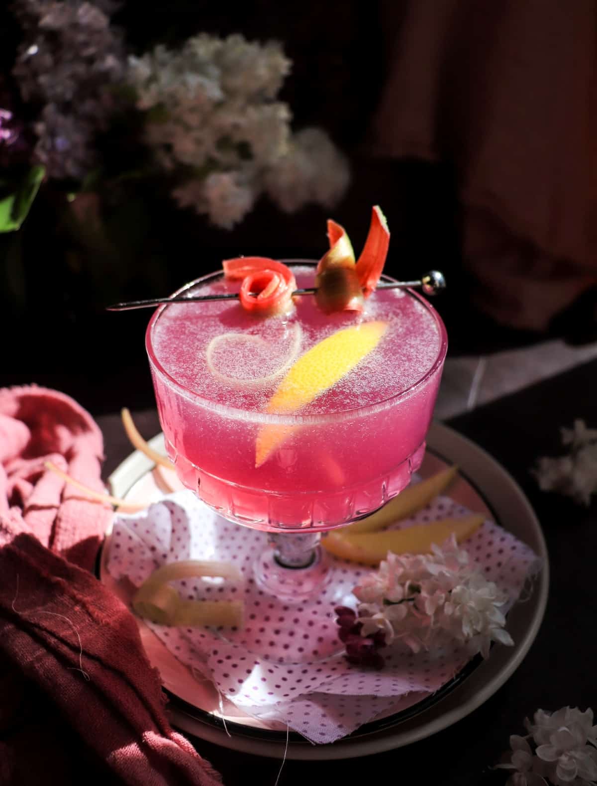Rhubarb Gin Cocktail with Empress 1908 Gin, lemon peel, and rhubarb garnish