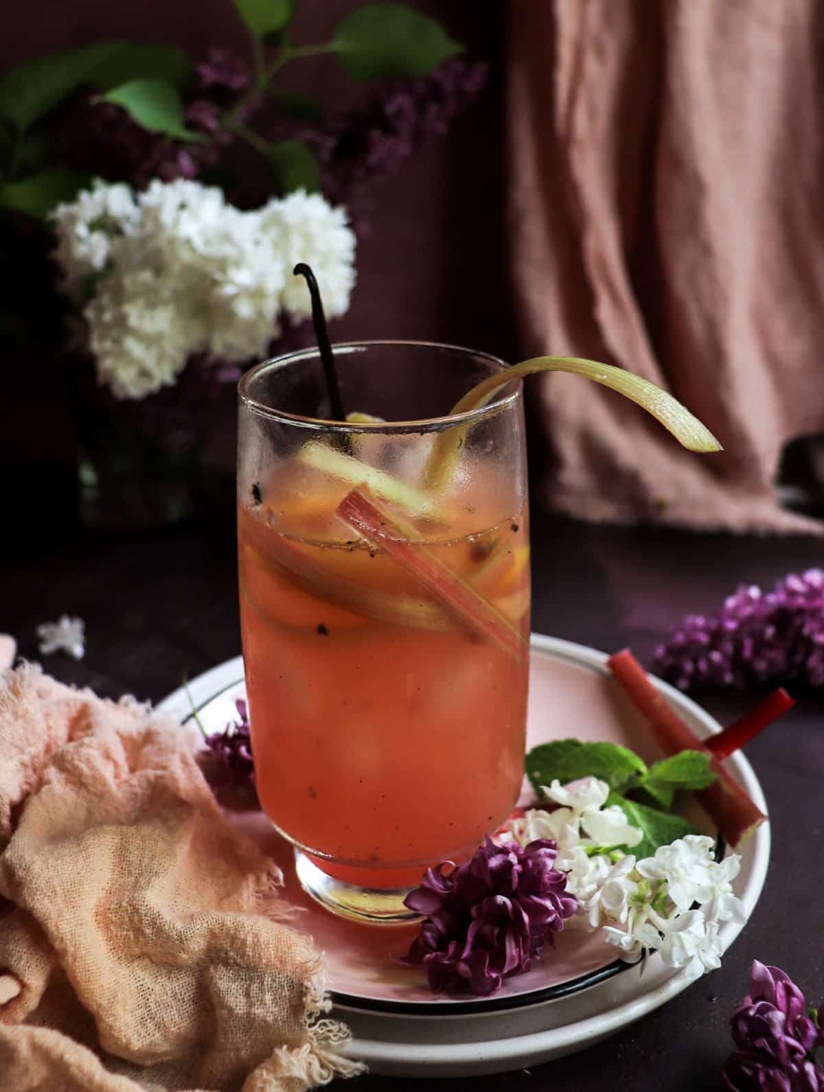 Refreshing rhubarb cocktail fizz with gin, vanilla, and homemade rhubarb syrup.