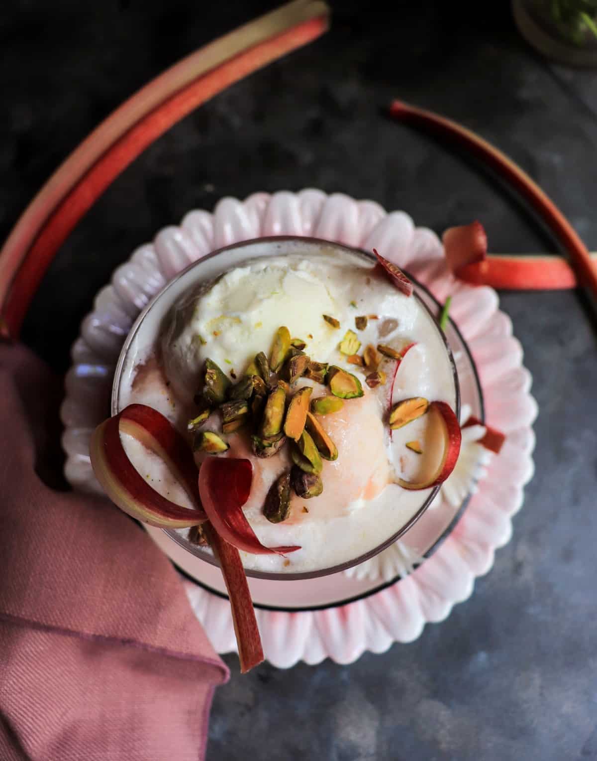 a creamy Rhubarb Float with vanilla ice cream and chopped pistachios.