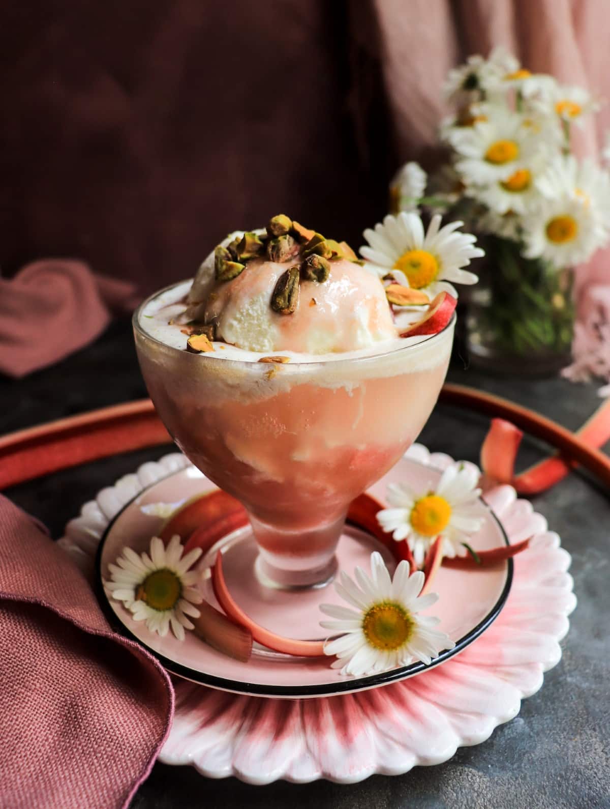 Creamy Rhubarb Ice Cream Float garnished with chopped pistachios