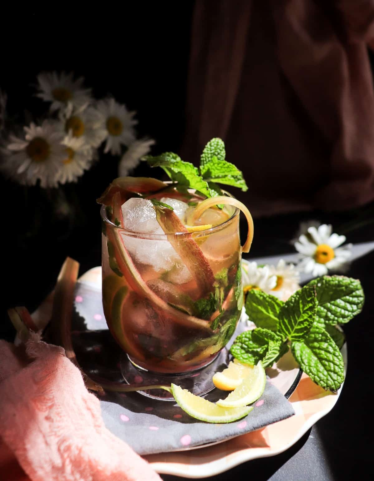 Non-alcoholic (virgin) rhubarb mojito with lime, mint, and rhubarb syrup.
