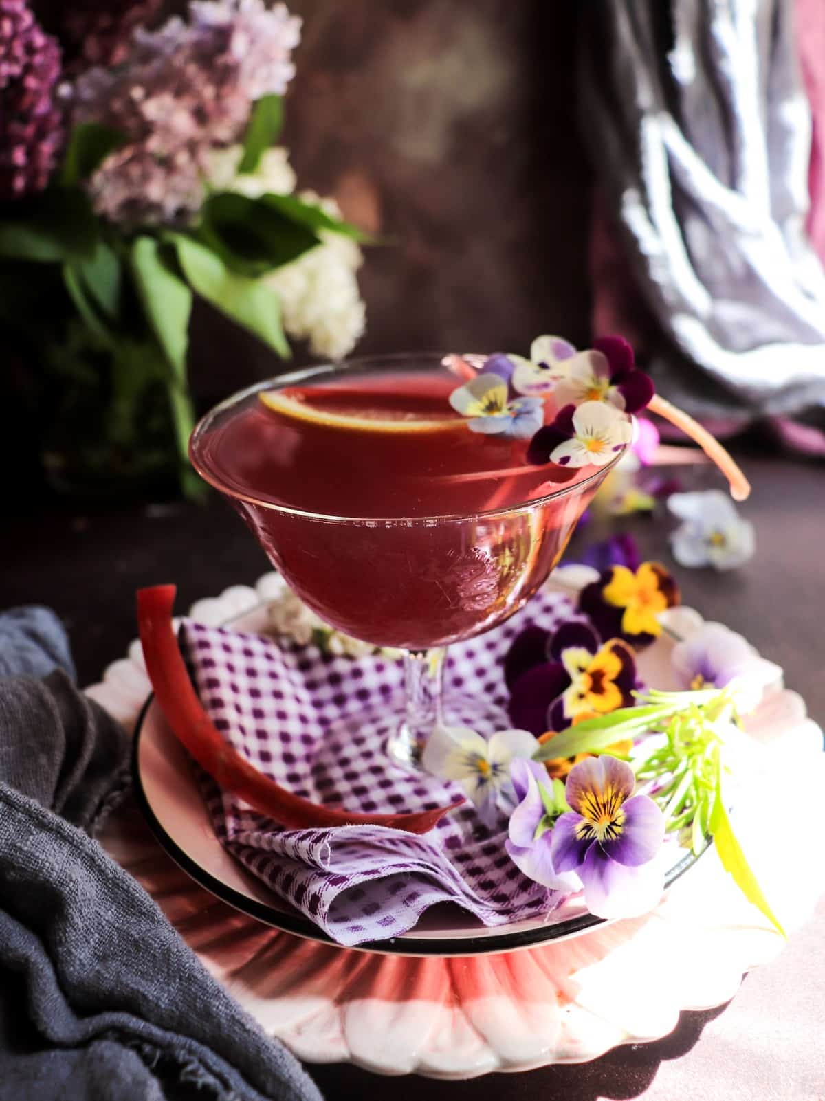 Rhubarb gin sour with violet liqueur