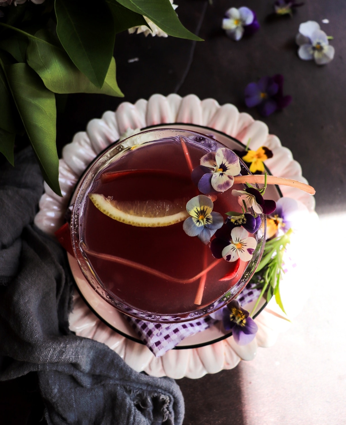 Floral gin cocktail with rhubarb and lemon