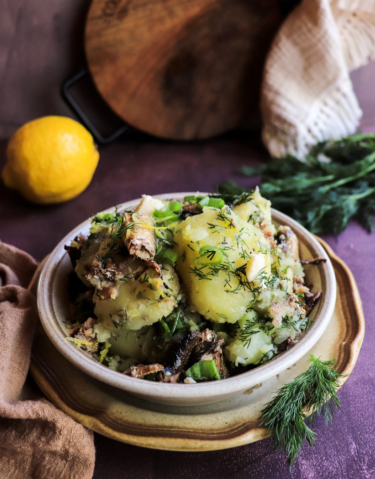 Nordic and Baltic inspired boiled potatoes with smoked sprats fish and herbs.