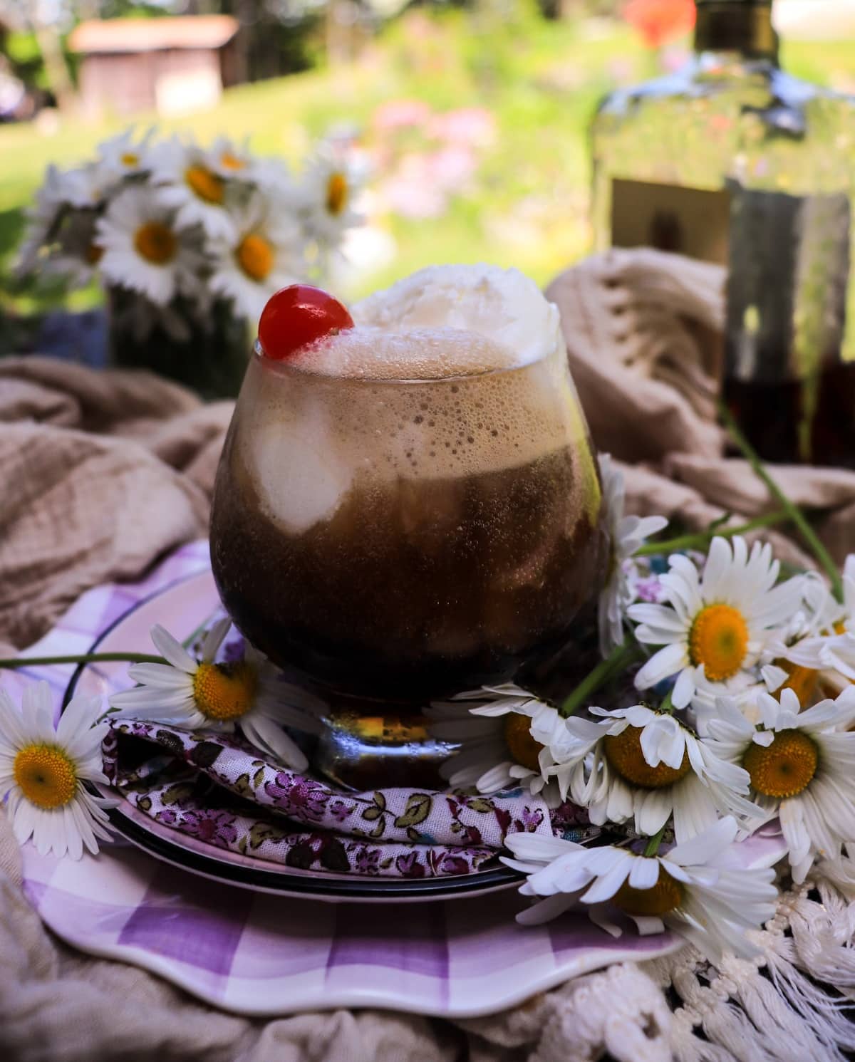 amaretto Coke float with vanilla ice cream and maraschino cherries