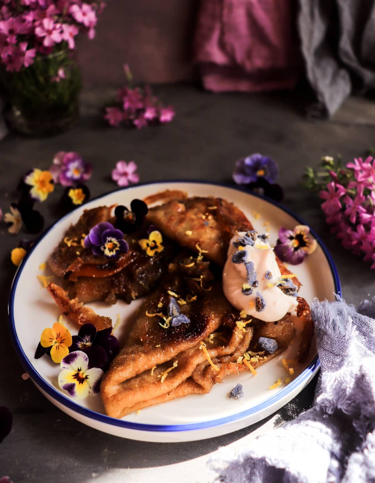 Crêpes Suzette with Crème de Violette and lemon served with creamy violet mascarpone