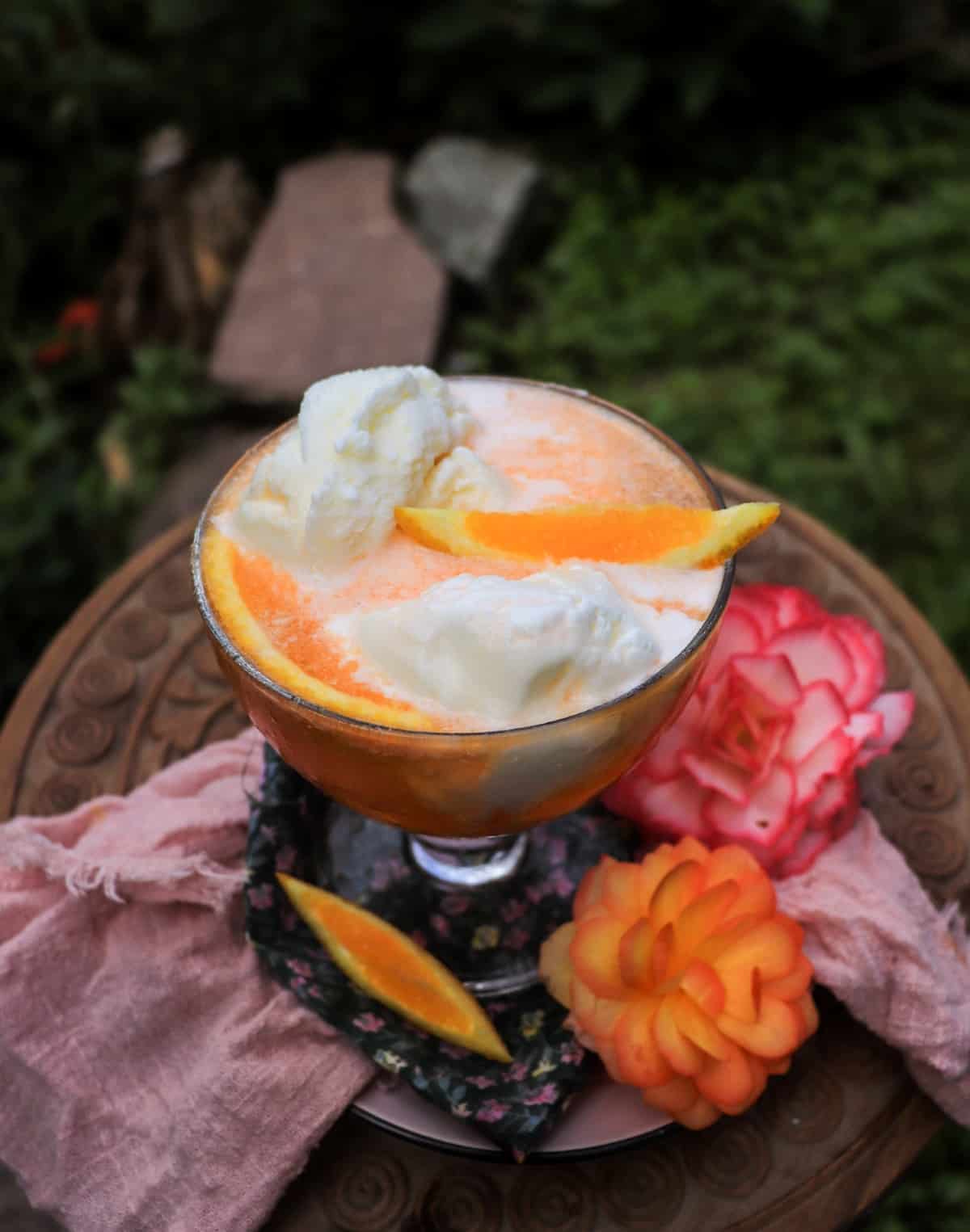 Adult orange creamsicle drink with creamy vanilla ice cream