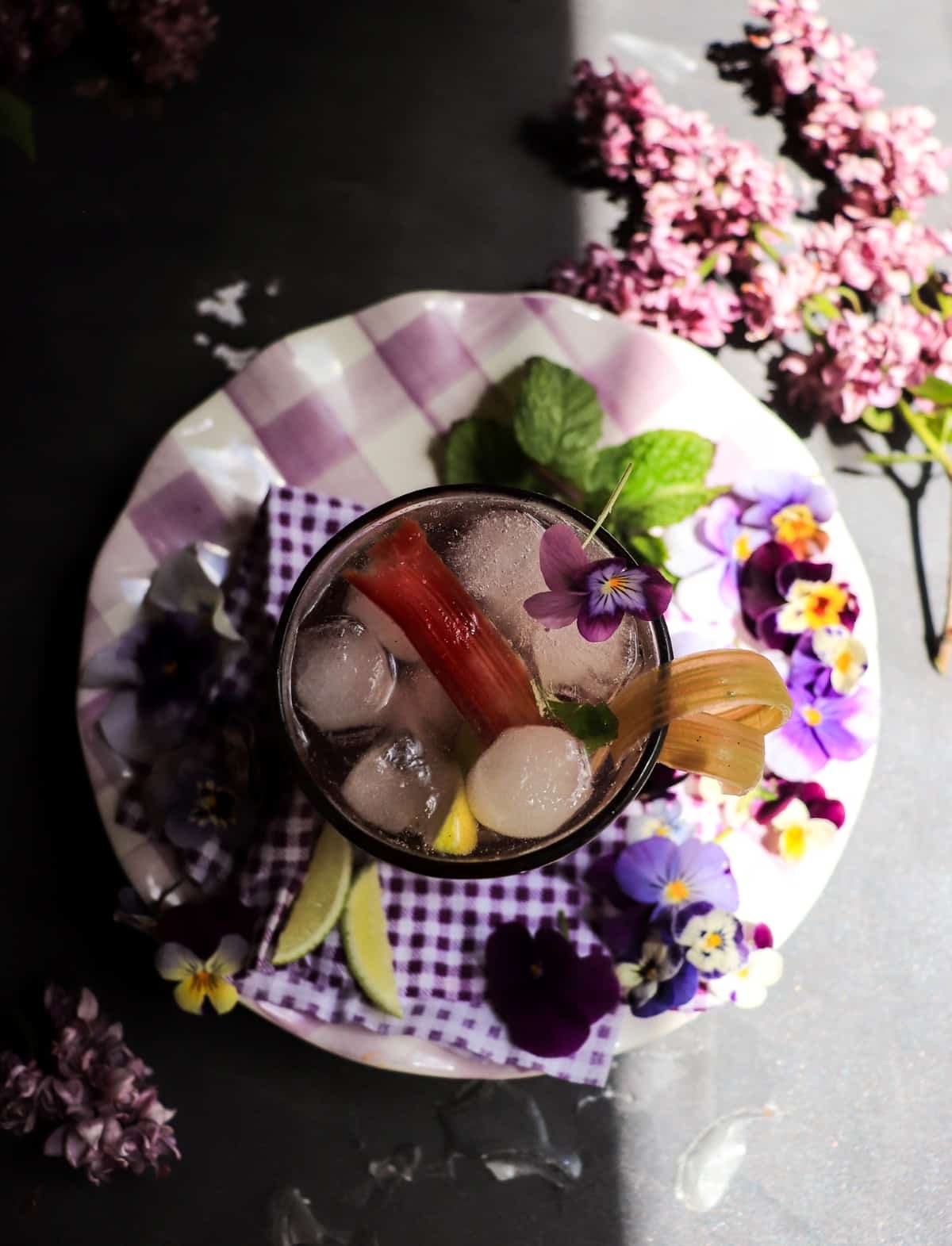gin fizz cocktail with homemade rhubarb syrup and violet liqueur