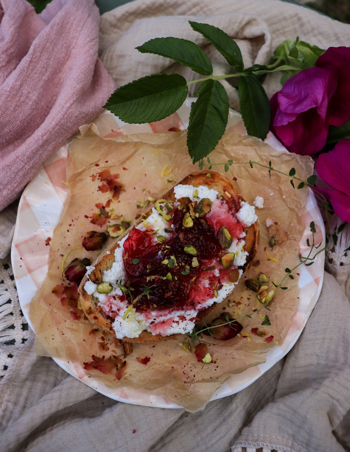 Ricotta toast with rose petal jam, pistachios, lemon zest and fresh thyme