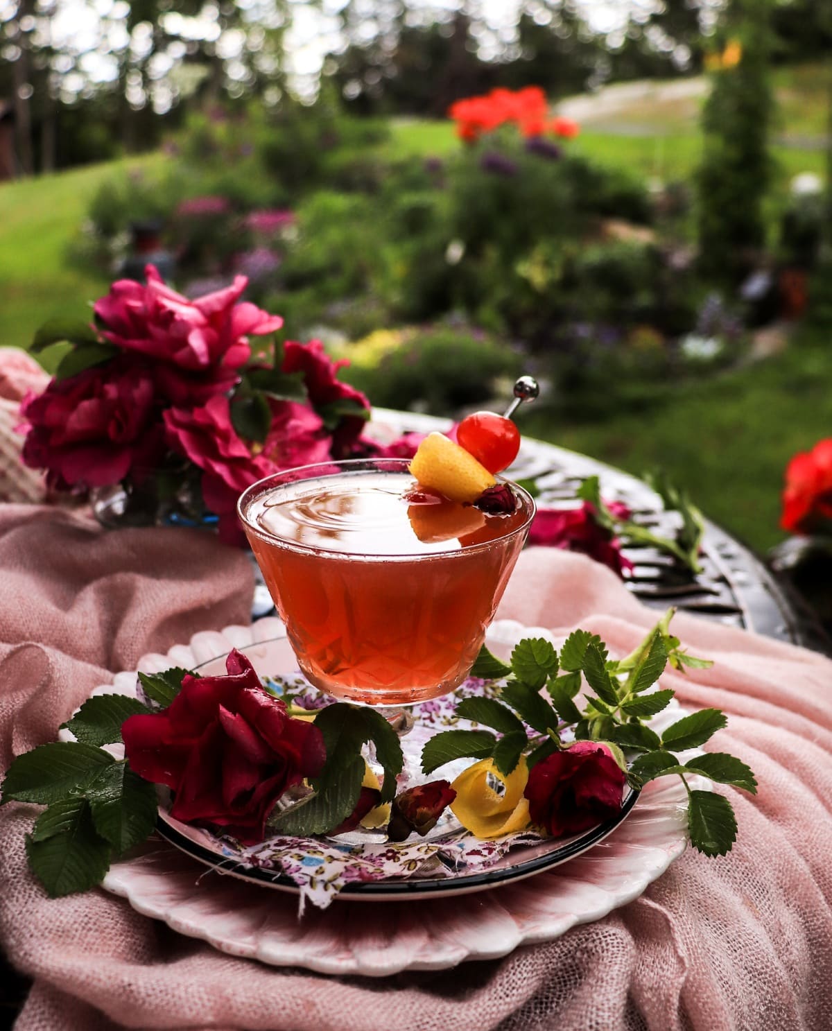Rose Amaretto Sour with gin, amaretto, rose petal jam, lemon and cherry bitters