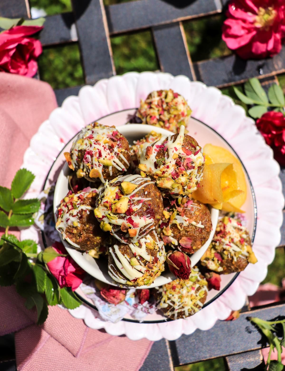 Rose and pistachio cookie truffles topped with white chocolate