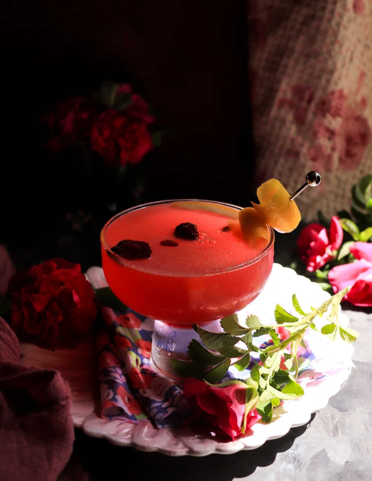 rose gin sour cocktail made with rose petal syrup and lemon