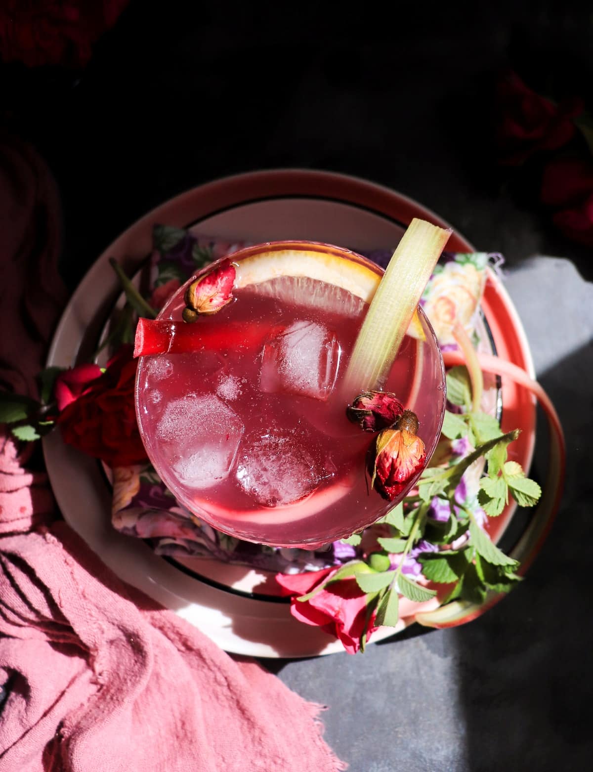 Rose Rhubarb Cocktail with Empress 1908 Gin, rose syrup and rhubarb garnish