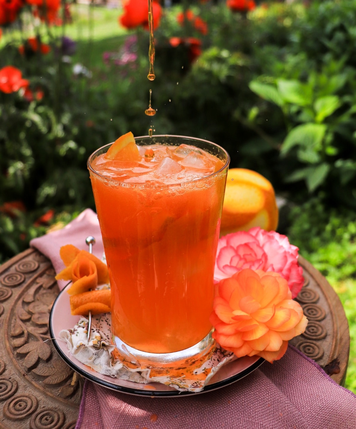 Pouring triple sec into a Spiked Orange Cream Soda
