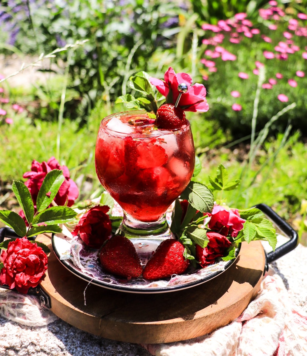 sparkling strawberry spritz cocktail with rose