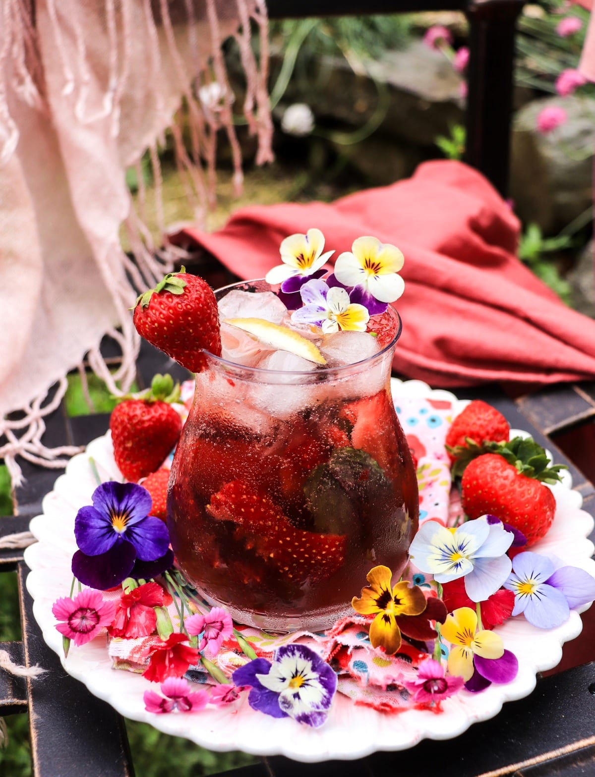 floral strawberry sparkling wine cocktail with violet cocktail