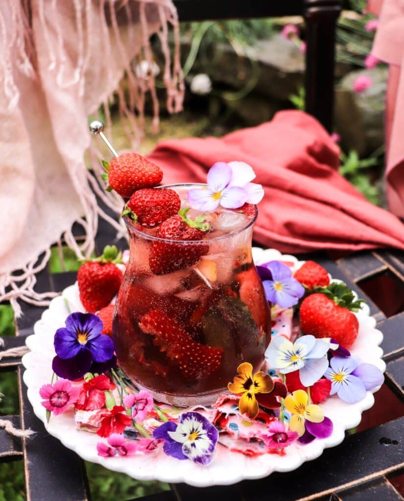 strawberry violet gin spritz with fresh strawberry and crème de violette