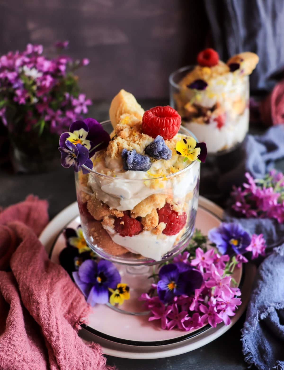 Individual violet liqueur trifles with mascarpone, shortbread and fresh raspberries