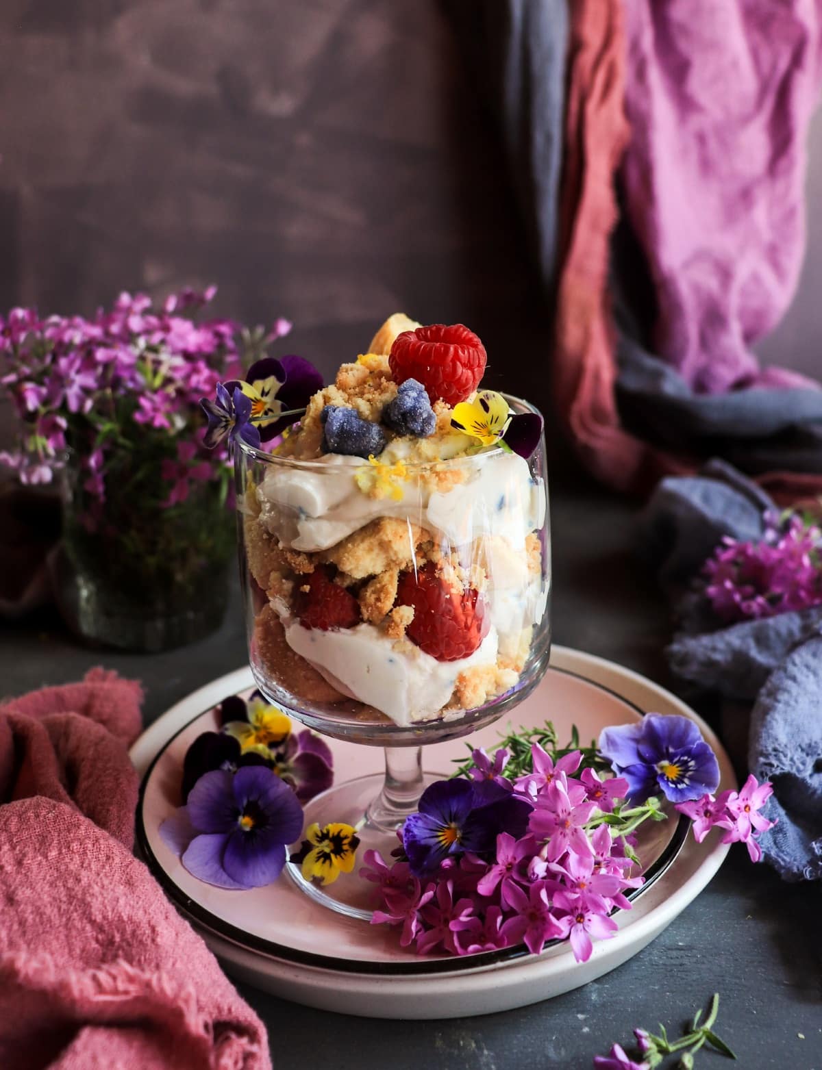 Raspberry violet trifle with mascarpone, shortbread cookies and candied violet petals