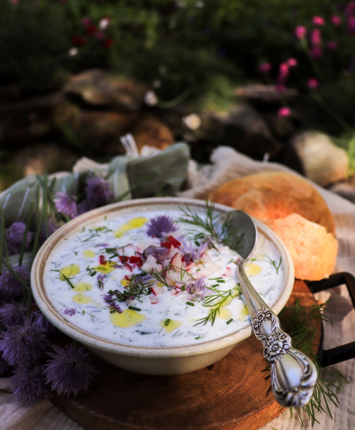 Cold cucumber soup with yogurt, kefir, cucumber, dill, and radish garnish