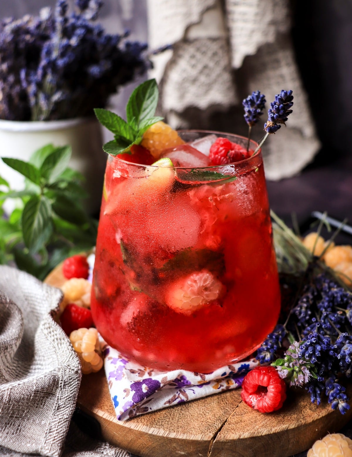 Non-alcoholic lavender raspberry cooler with fresh raspberries