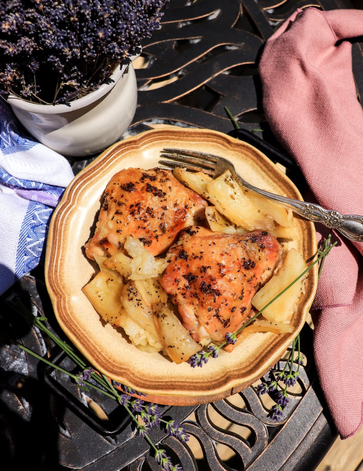 Roasted chicken and potatoes with lavender served with herbs de Provence and lemon