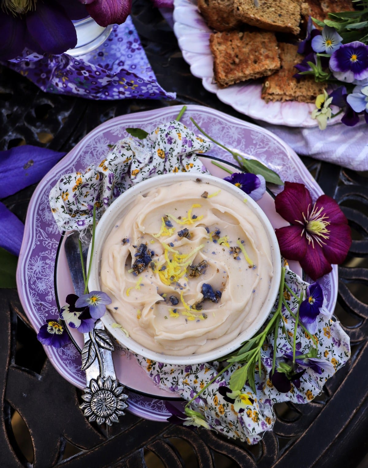 Floral honey butter with lemon zest and candied violets