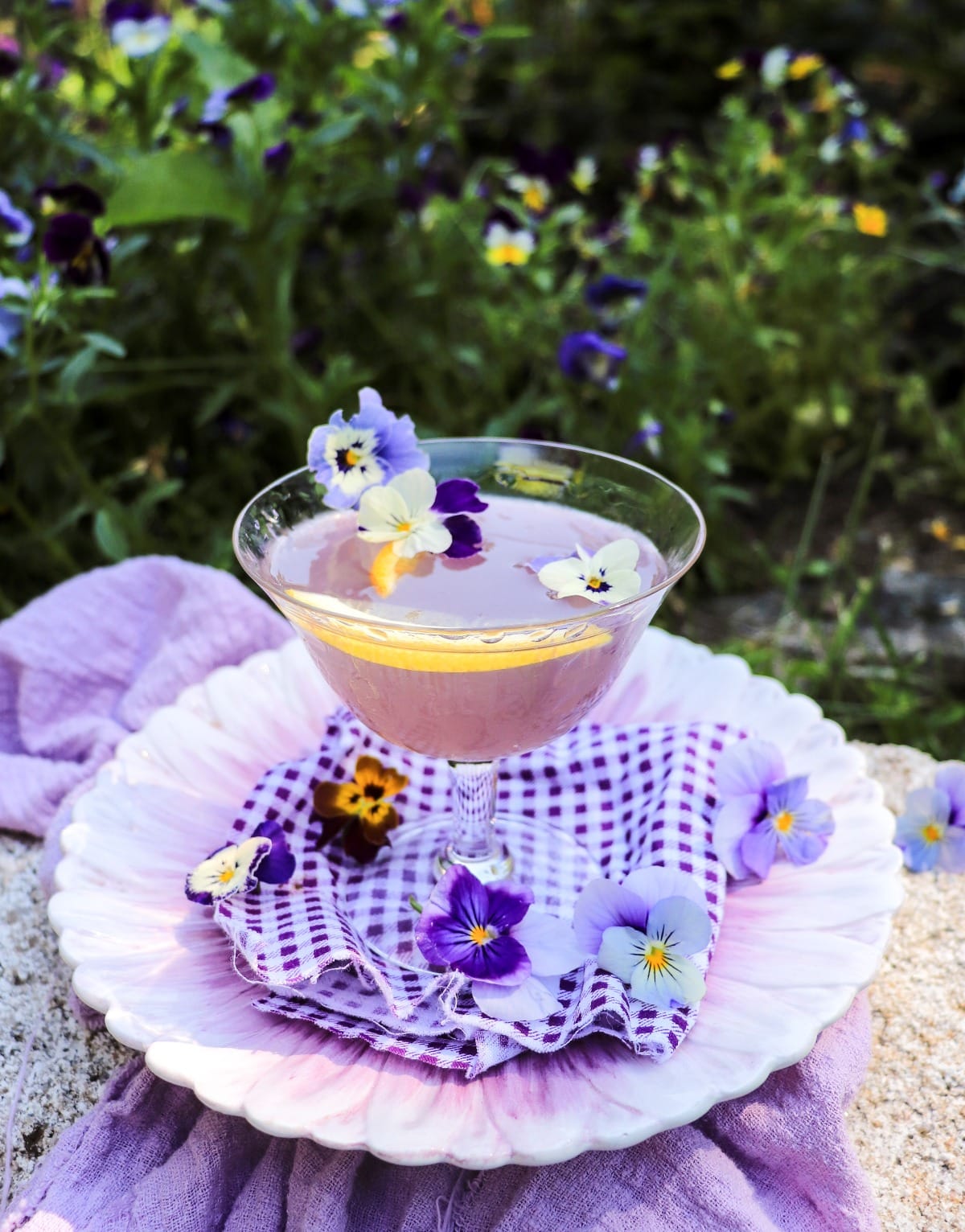 Water Lily cocktail with crème de violette, Cointreau, gin, and edible flowers