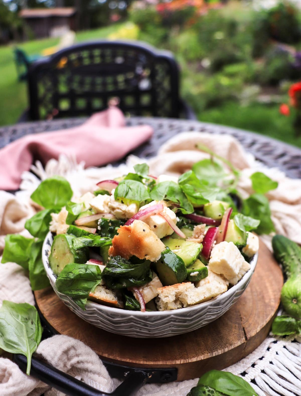 cucumber salad with toasted bread, red onions, and feta