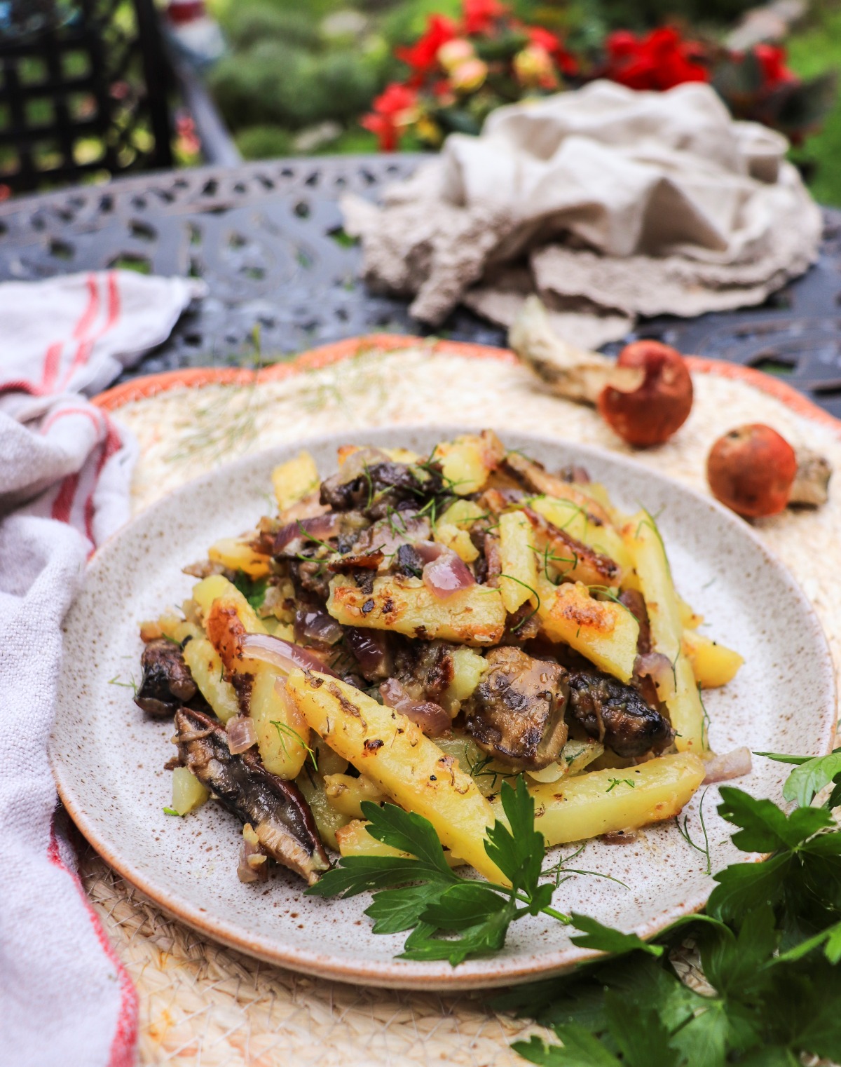 fried potatoes and onions with boletus mushrooms