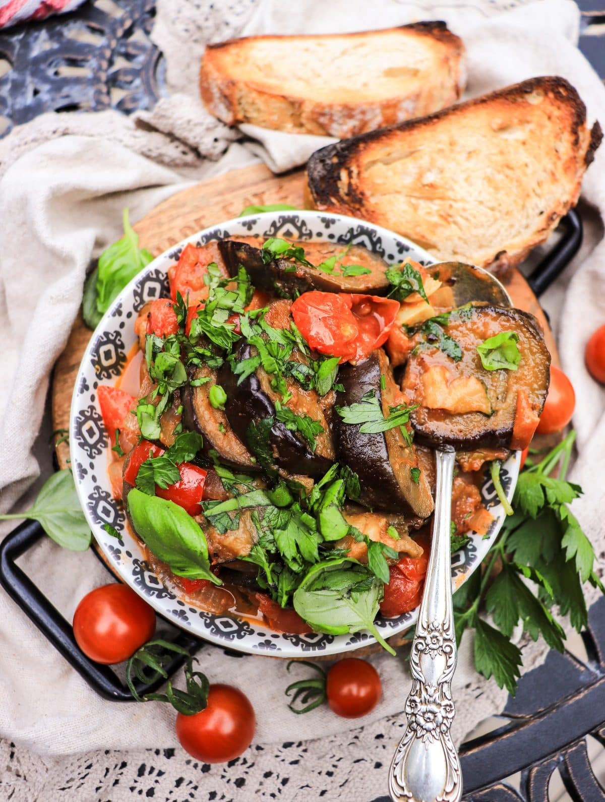 Ggeorgian eggplant stew with sweet peppers, fresh tomatoes, and basil