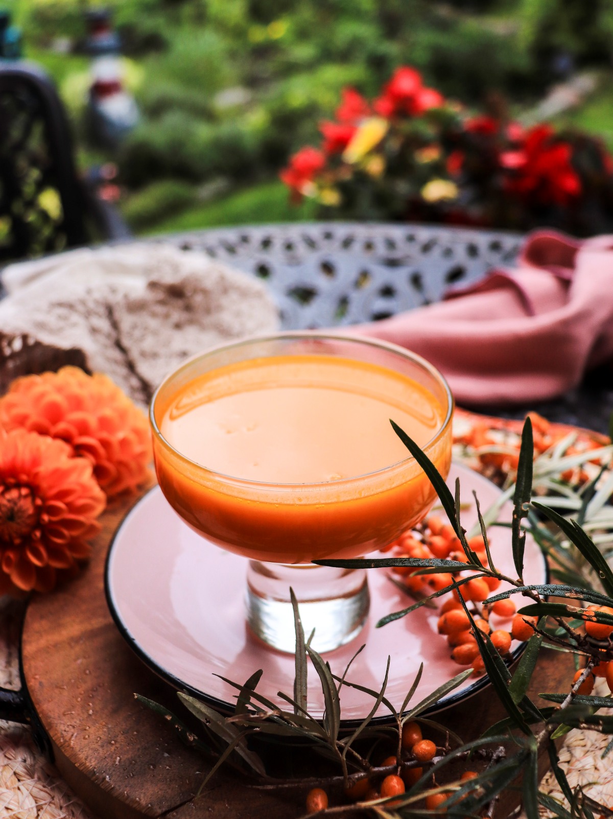 Homemade sea buckthorn syrup with fresh berries