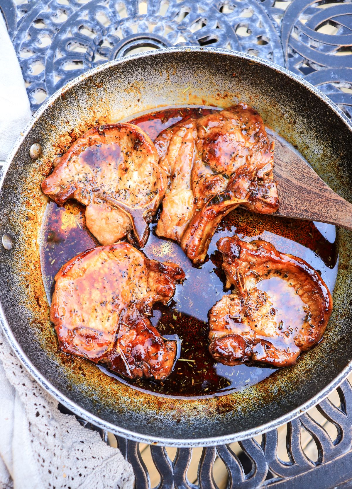 pan fried honey lavender pork chops in a skillet