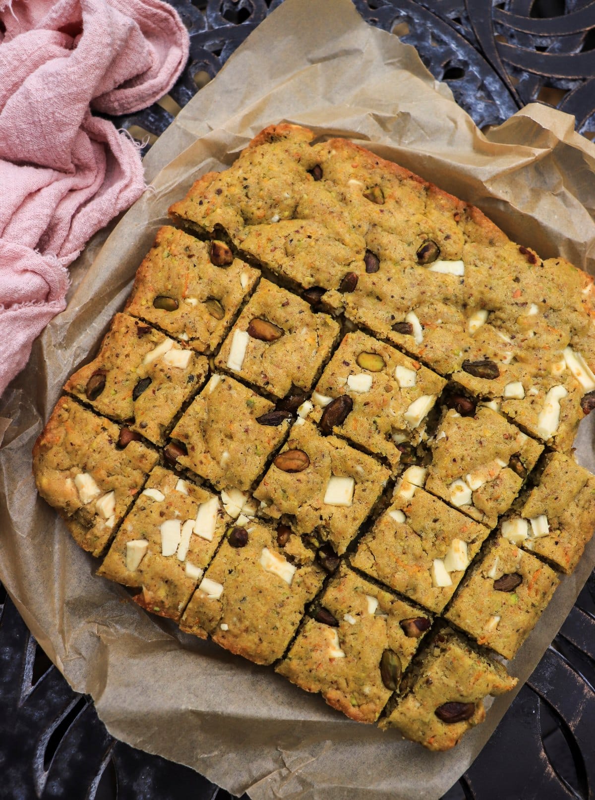 baked pistachio cake bars with white chocolate in a baking pan
