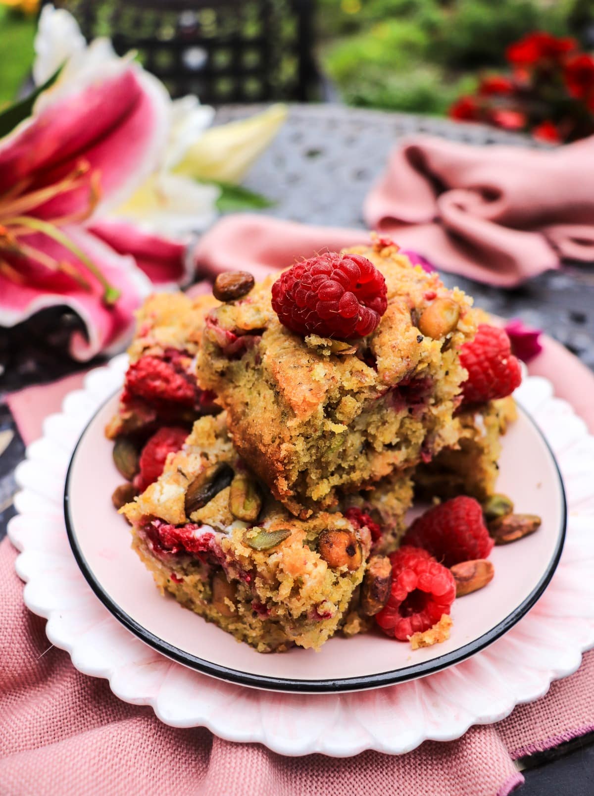 pistachio cake bars with fresh raspberries