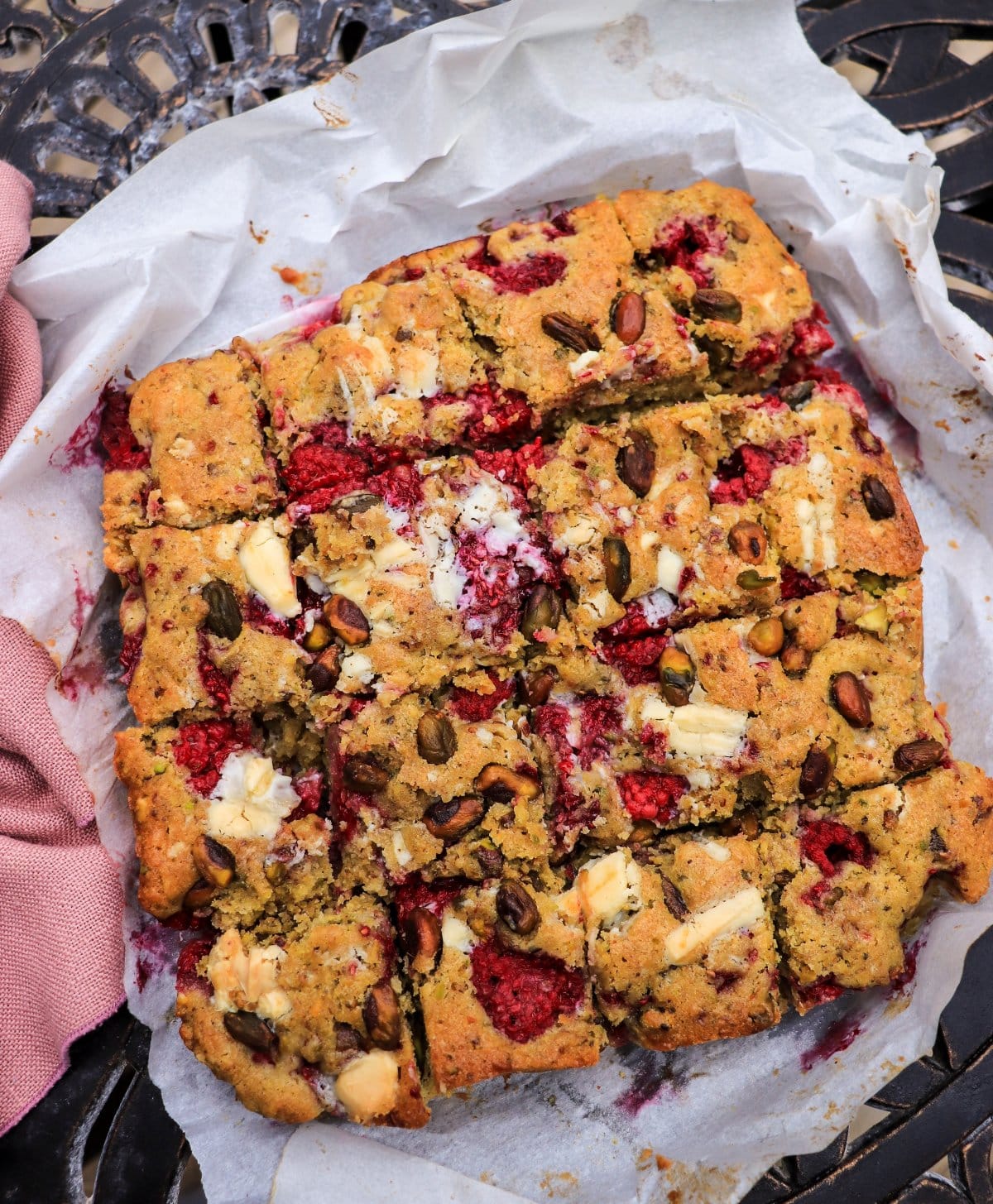raspberry pistachio bars with white chocolate chunks