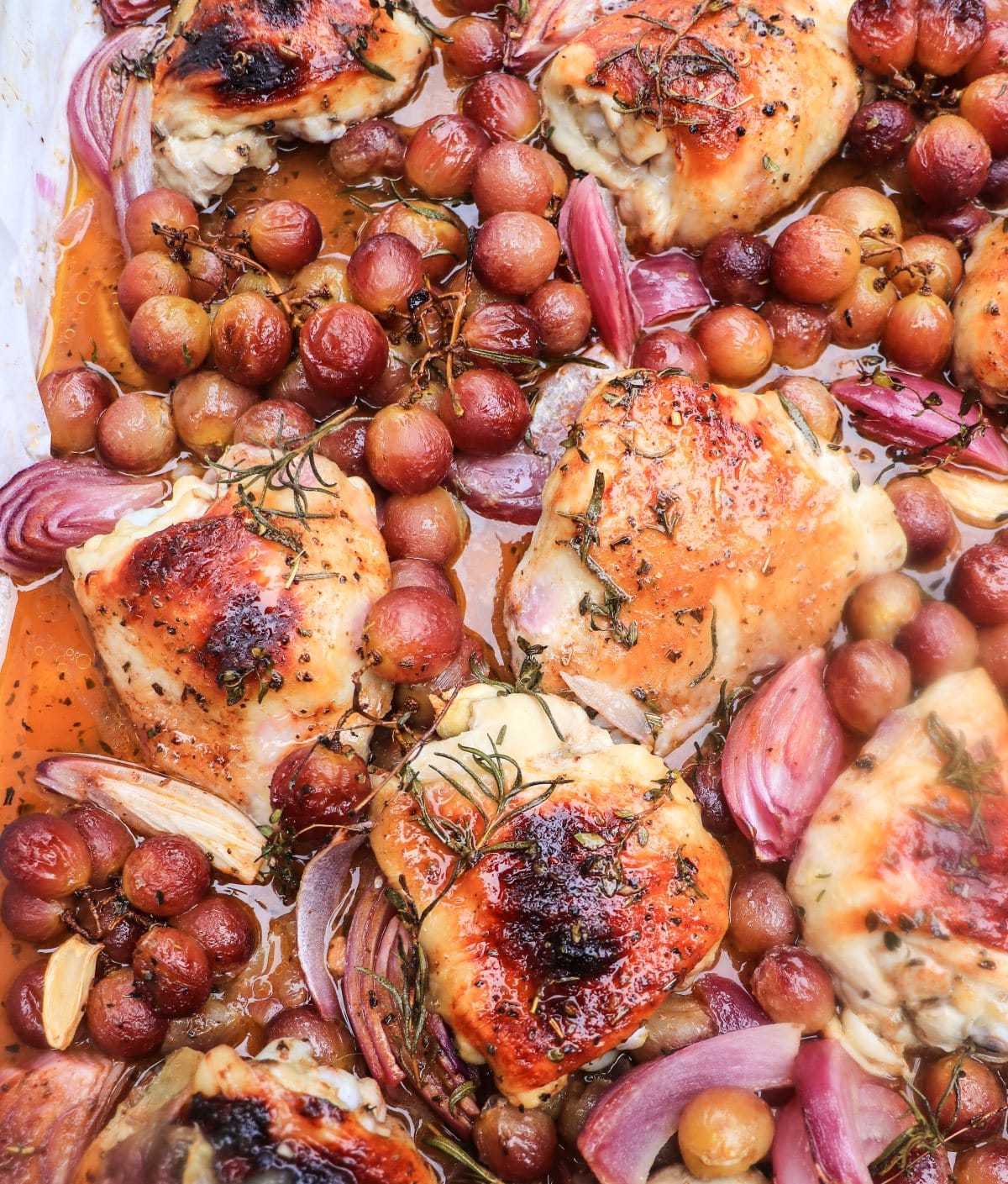 sheet pan roasted chicken with grapes, caramelized red onions, and balsamic pan glaze