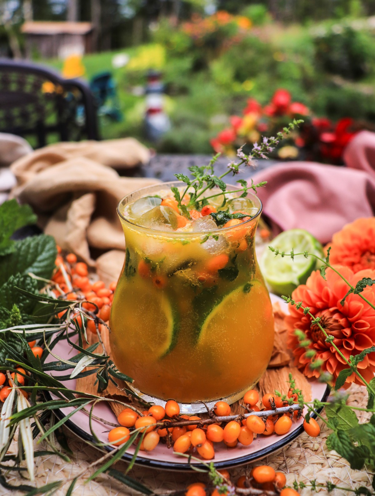 Sea buckthorn syrup cocktail with rum and lime