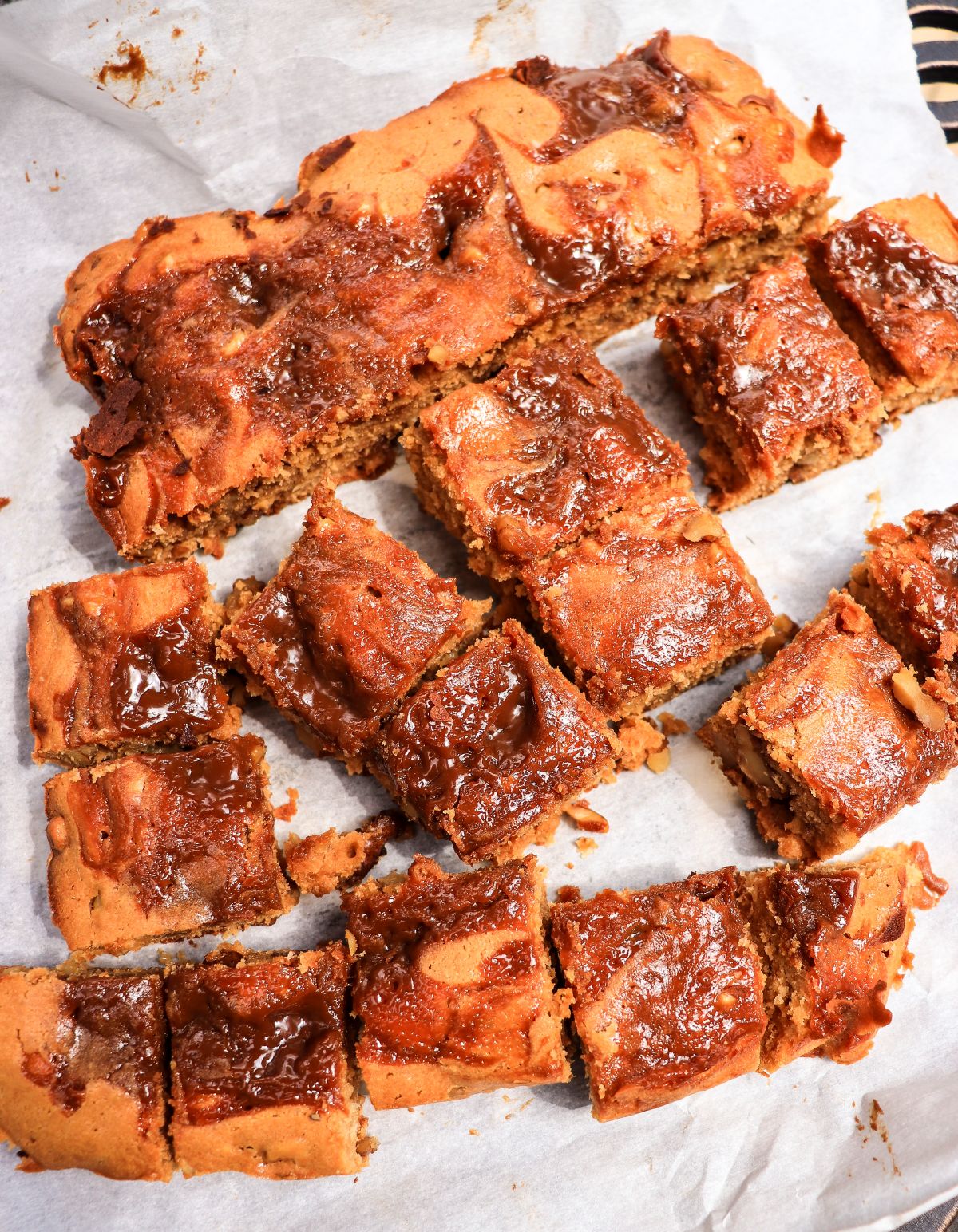 sliced dulce de leche dessert bars with walnuts