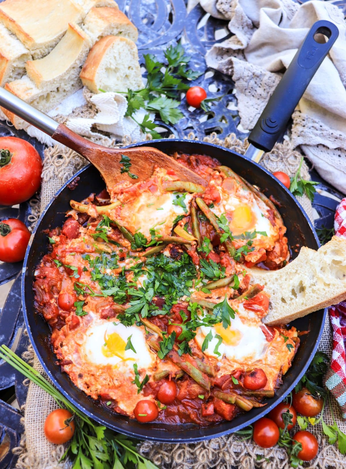 shakshuka with green beans, tomatoes, and eggs