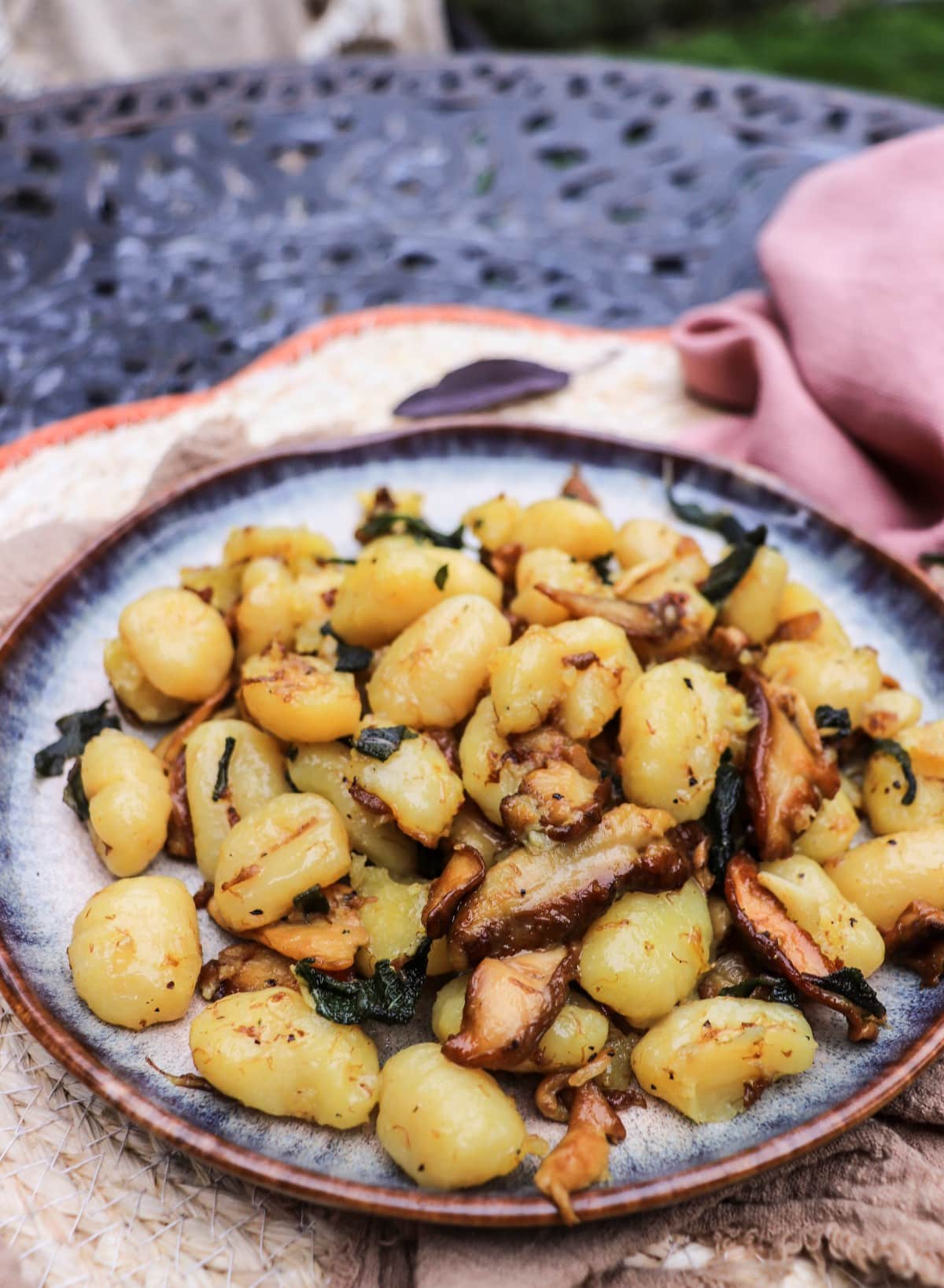 crisp sage mushroom gnocchi on a plate